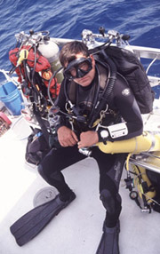 A technical diver suited up and ready to dive.