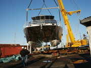Looking at the bow of the R/V Manta as it is suspended in the air from a crane.