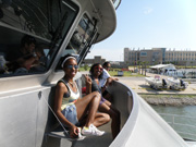 Students sitting in front of the pilot house of the R/V Manta.