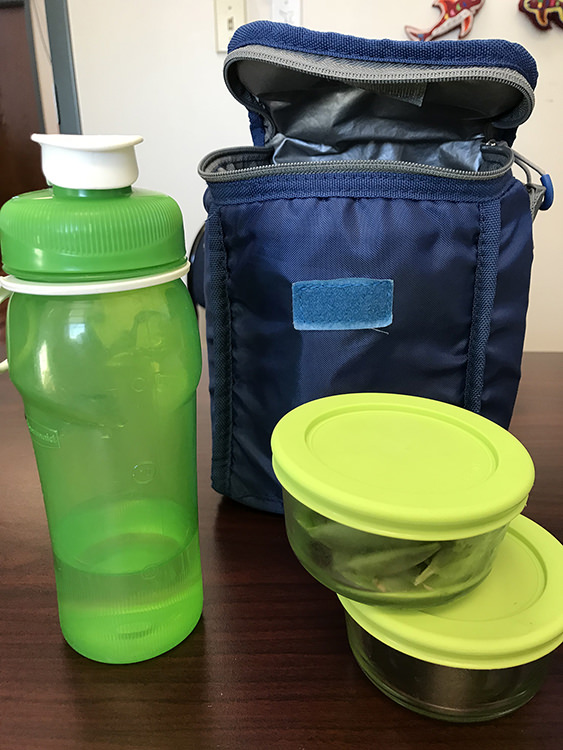 Reusable water bottle, 2 reusable glass containers with lids, and a reusable lunch bag